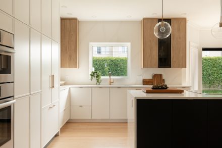 Airy kitchen with white, black and oak cabinets 