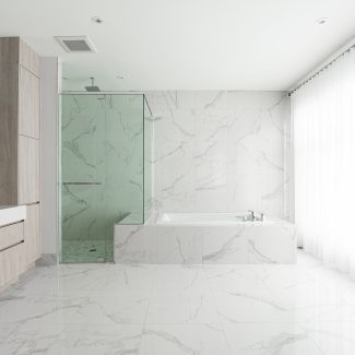 Modern bathroom furniture with light-colored cabinets.