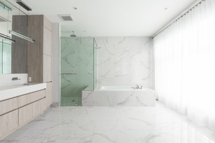 Modern bathroom furniture with light-colored cabinets.