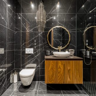 Dark bathroom with elegant storage.