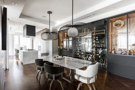 Sleek kitchen cabinets with light countertops.