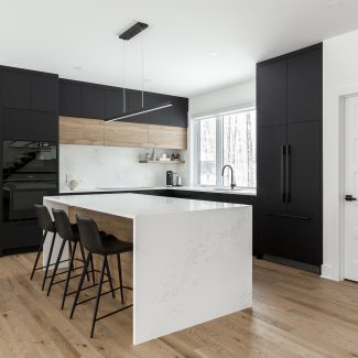 Modern kitchen cabinet with stainless steel handles.