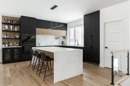 Modern kitchen cabinet with stainless steel handles.