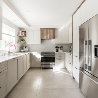 Modern white kitchen with a light-colored countertop and streamlined cabinets.