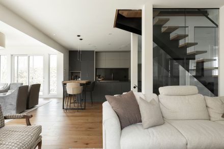 Over view of contempary kitchen with central island and dark counters.