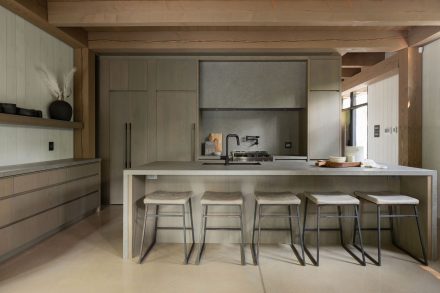 Beautiful grey contemporary kitchen with wooden ceiling.
