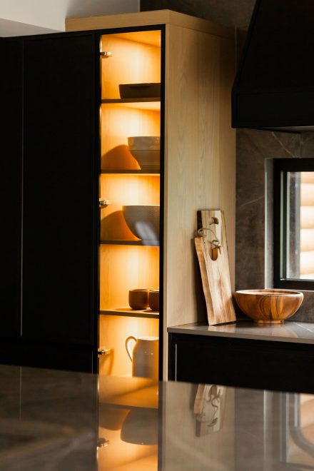 Contemporary kitchen with central island and intergrated storage.