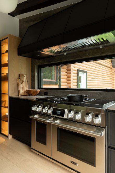 Contemporary kitchen with central island and intergrated storage.