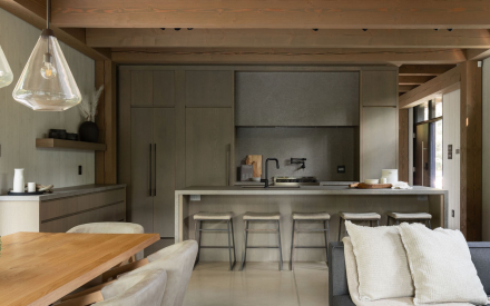 Grey kitchen with wood table