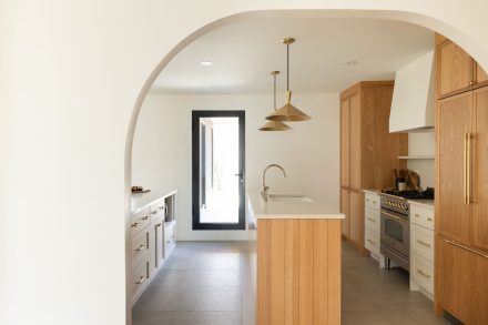 View of the kitchen where wood is in the spotlight