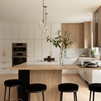 Airy kitchen with island and plenty of workspace.