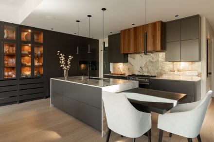 Sophisticated kitchen with dark cabinets and plenty of storage.