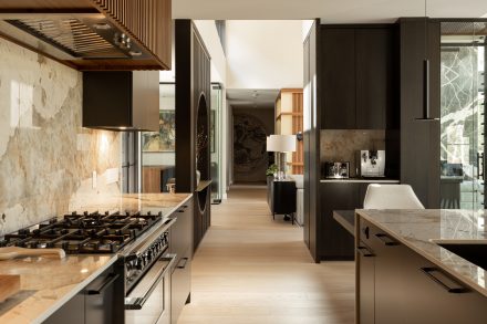 Well-organized kitchen with plenty of integrated storage and dark cabinets.