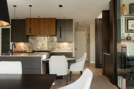 Elegant kitchen with dark cabinets and a subtle touch of wood.