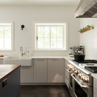 Modern kitchen furniture, cabinets with elegant handles.