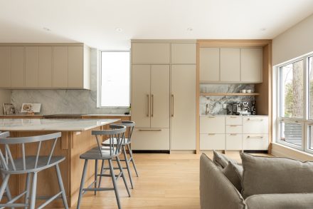 Custom kitchen with stone countertop and Ateliers Jacob cabinets.