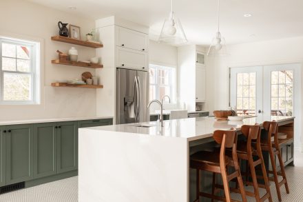 White kitchen, central kitchen island and integrated storage