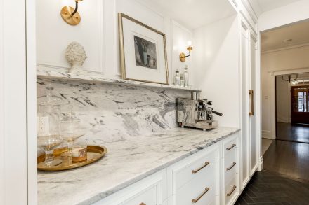 White kitchen by Ateliers Jacob with white cabinets.