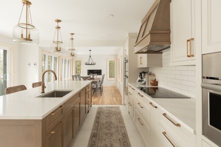 A contemporary kitchen with spacious worktop and elegant cabinets.