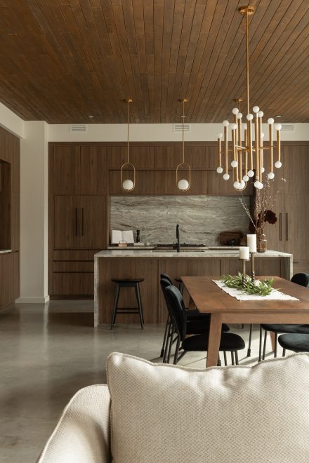 Kitchen designed by Ateliers Jacob with custom cabinets in wood and a kitchen island