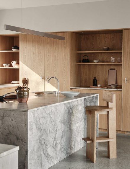 Architect's house interior. Site-built wooden kitchen in a modern design. Interior in japandi style.